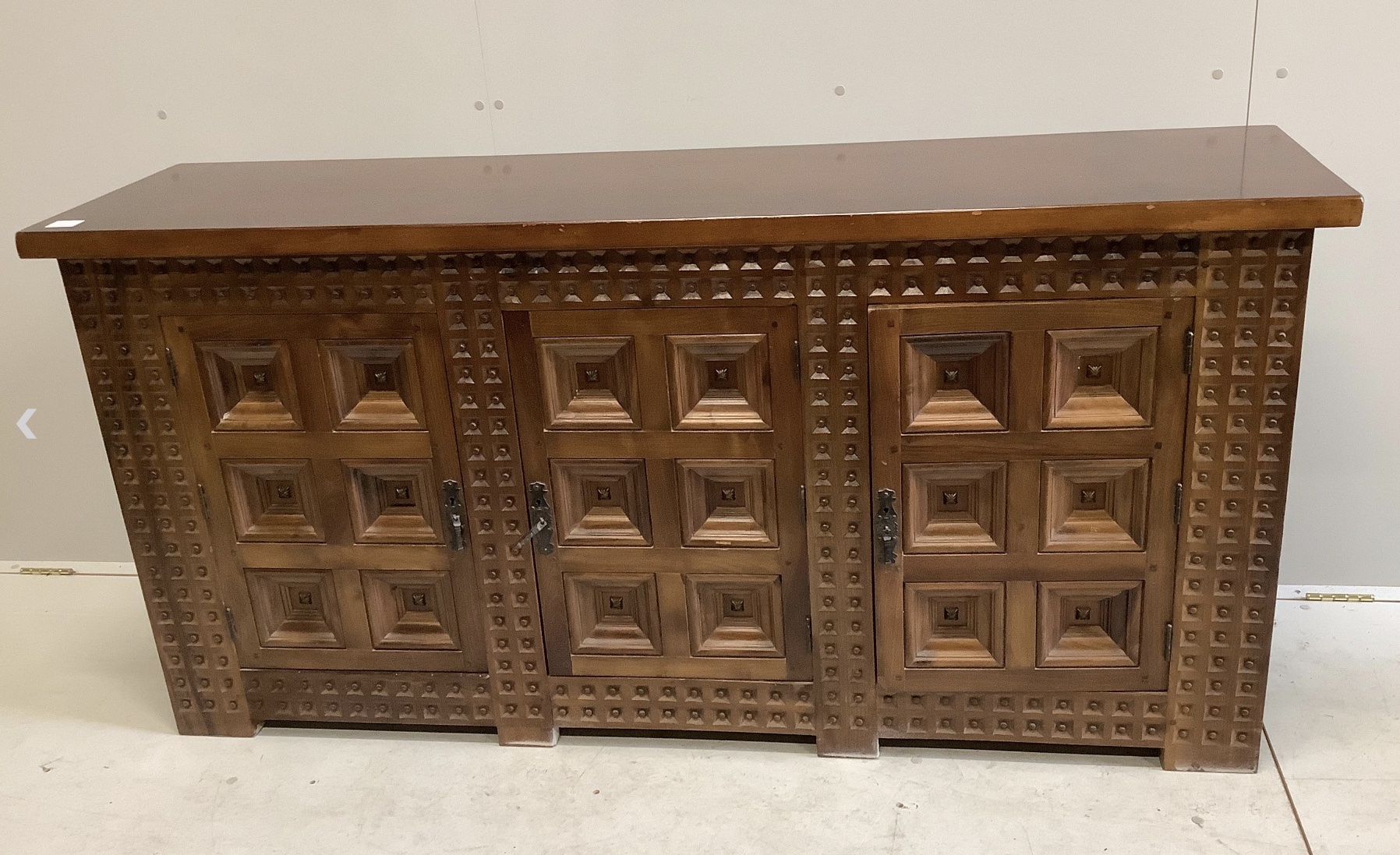 A Spanish walnut and fruitwood sideboard, width 171cm, depth 43cm, height 84cm